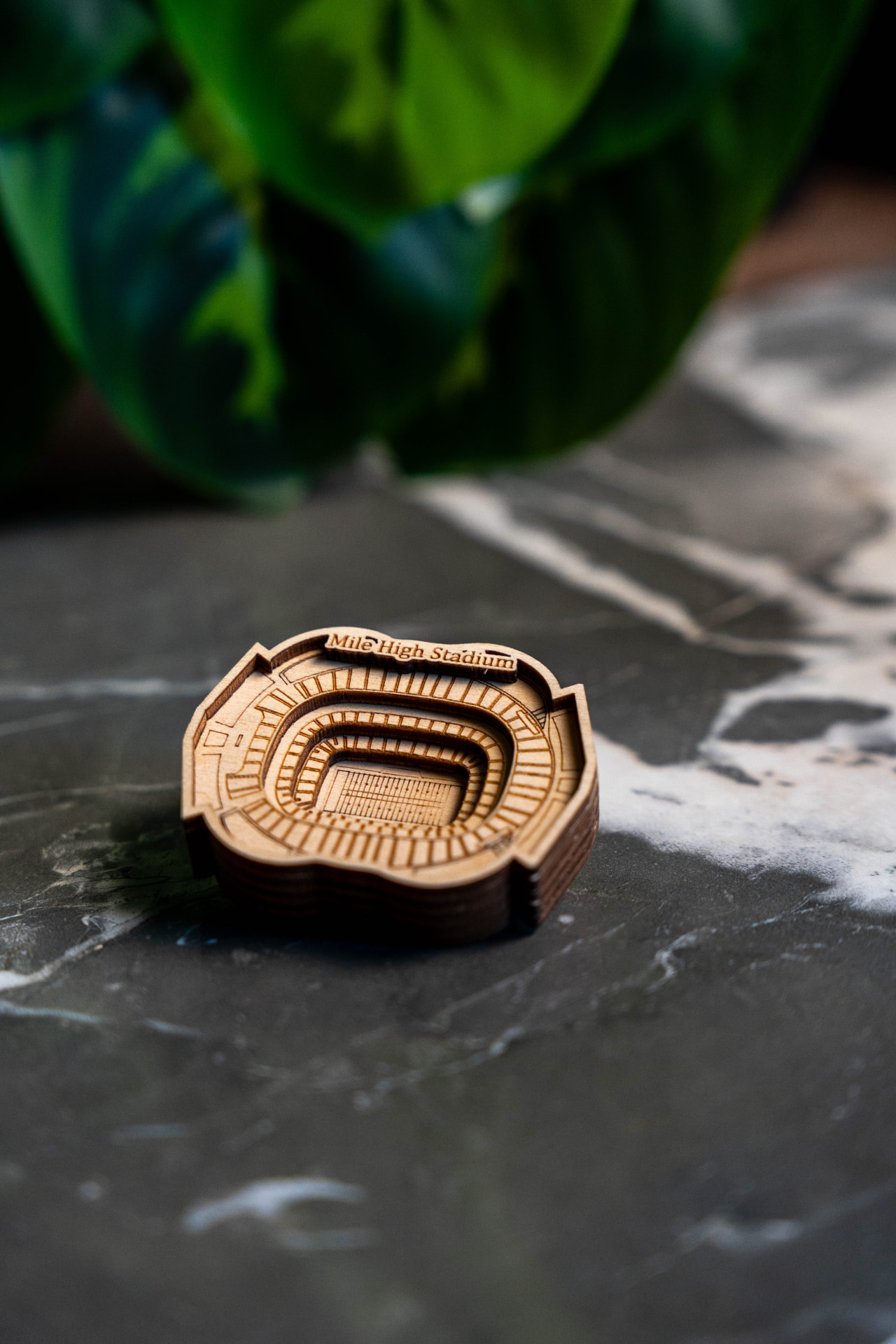 Layered 3D Mile High Stadium keepsake on a marble table