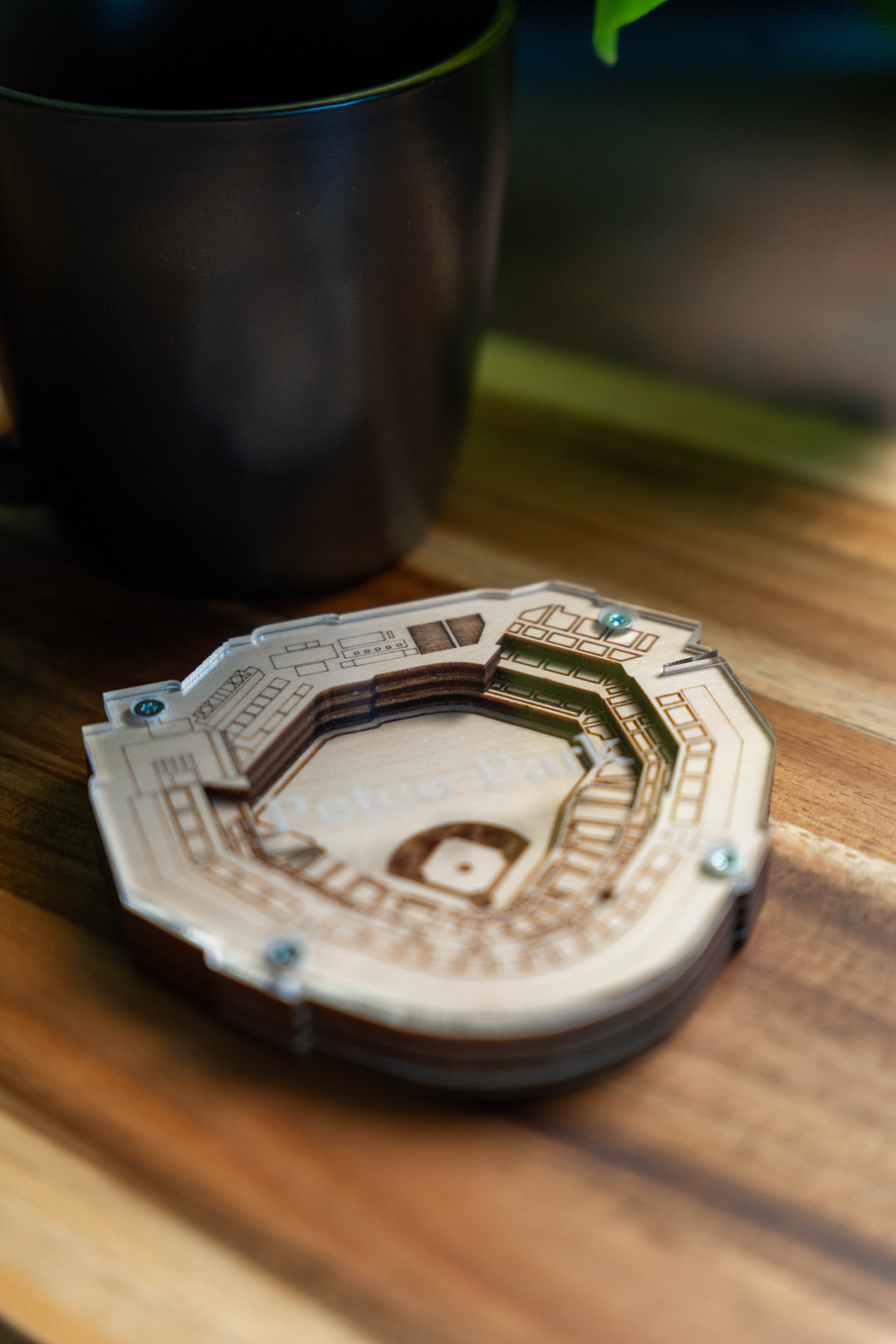 Layered 3D Petco Park keepsake next to a coffee mug